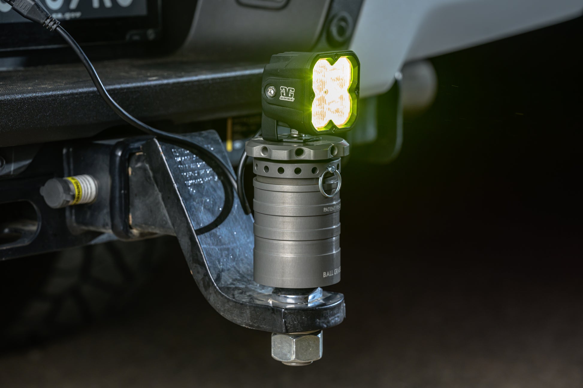 Close up of a GP10 light mounted on the QBM, powered by the Hitch Switch.